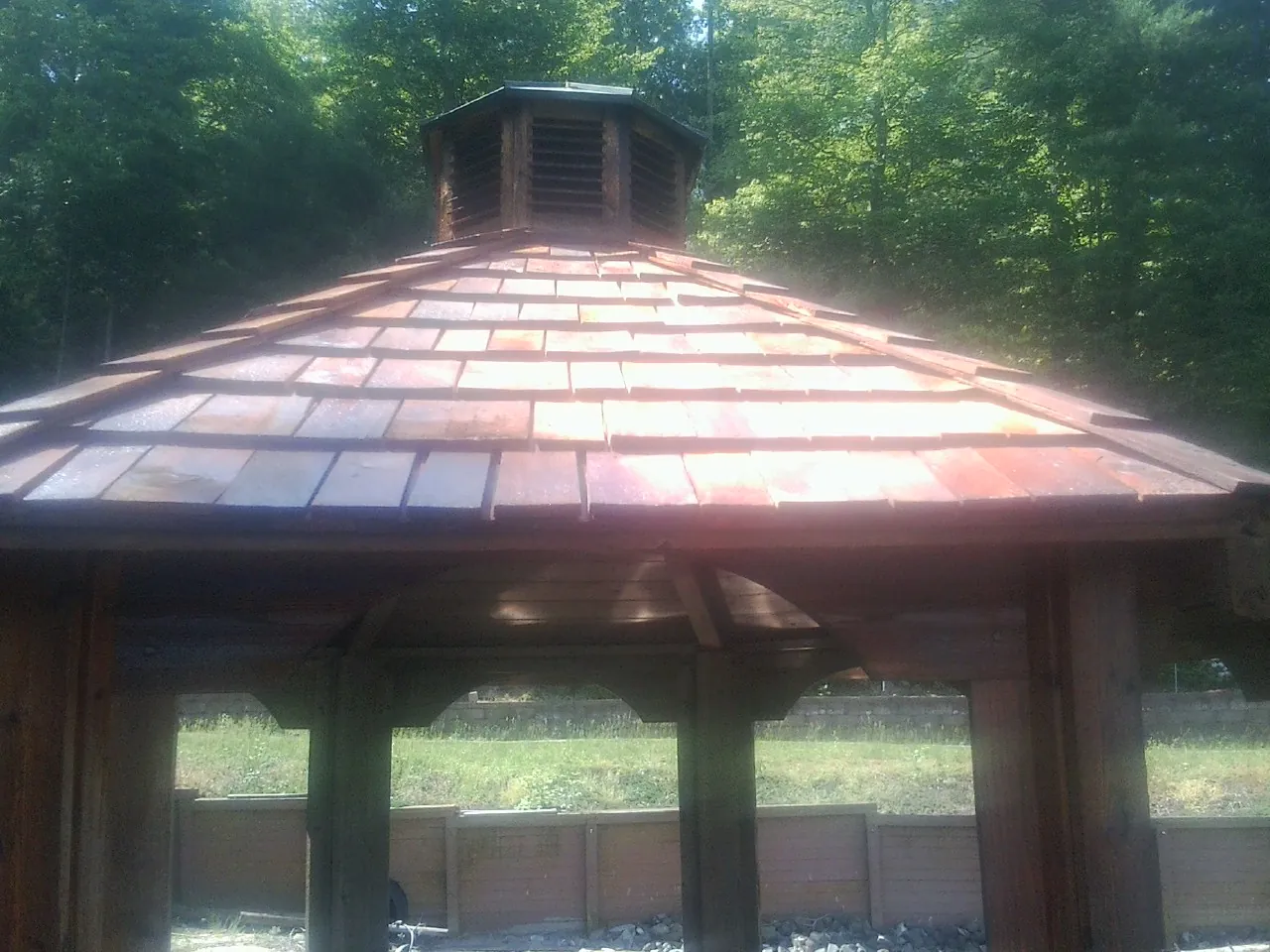 New cedar shake roof and cupola on a lakeside gazebo in Elkhart
